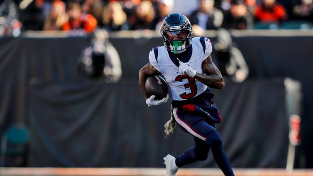 Texans wide receiver Tank Dell (3) runs with the ball against the Cincinnati Bengals in the first half at Paycor Stadium.